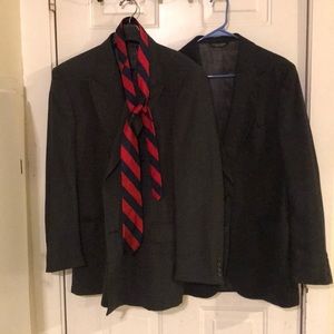 Two men’s suit jackets w tie